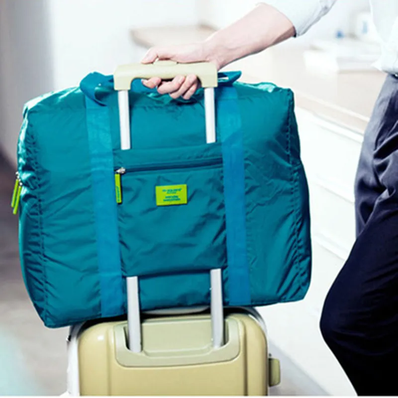 

2019 new Korean version of the travel folding large capacity travel bag duffel bag portable waterproof nylon clothes storage bag
