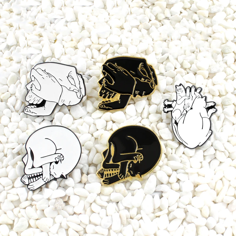 

Skeleton Hands clasped gesture Fish and cat twine together Male and female hug Composition Black and White Punk skull brooch