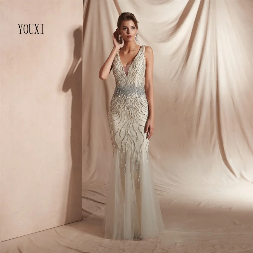 

Sexy Shiny Beaded Crystal Light Champagne Long Evening Dresses 2018 Luxury Sleeveless V-Neck Formal Mermaid Prom Gowns