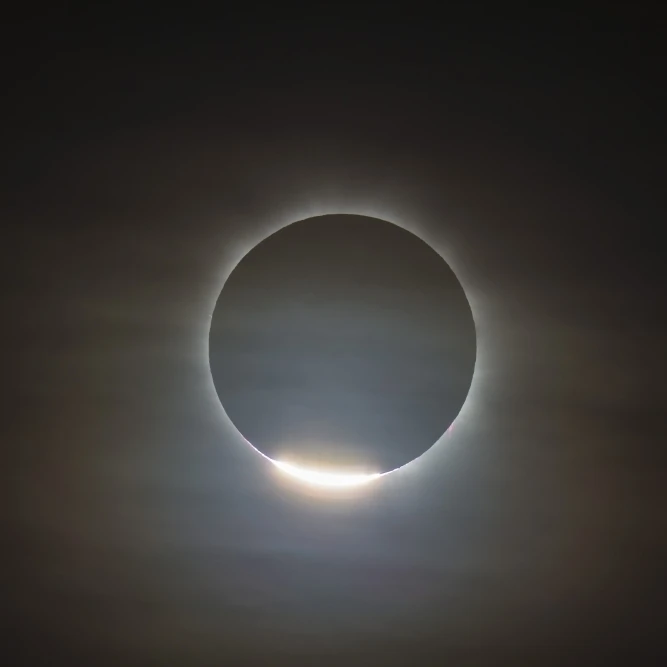 The first diamond ring during the total eclipse of the Sun Poster Print (17 x 11)