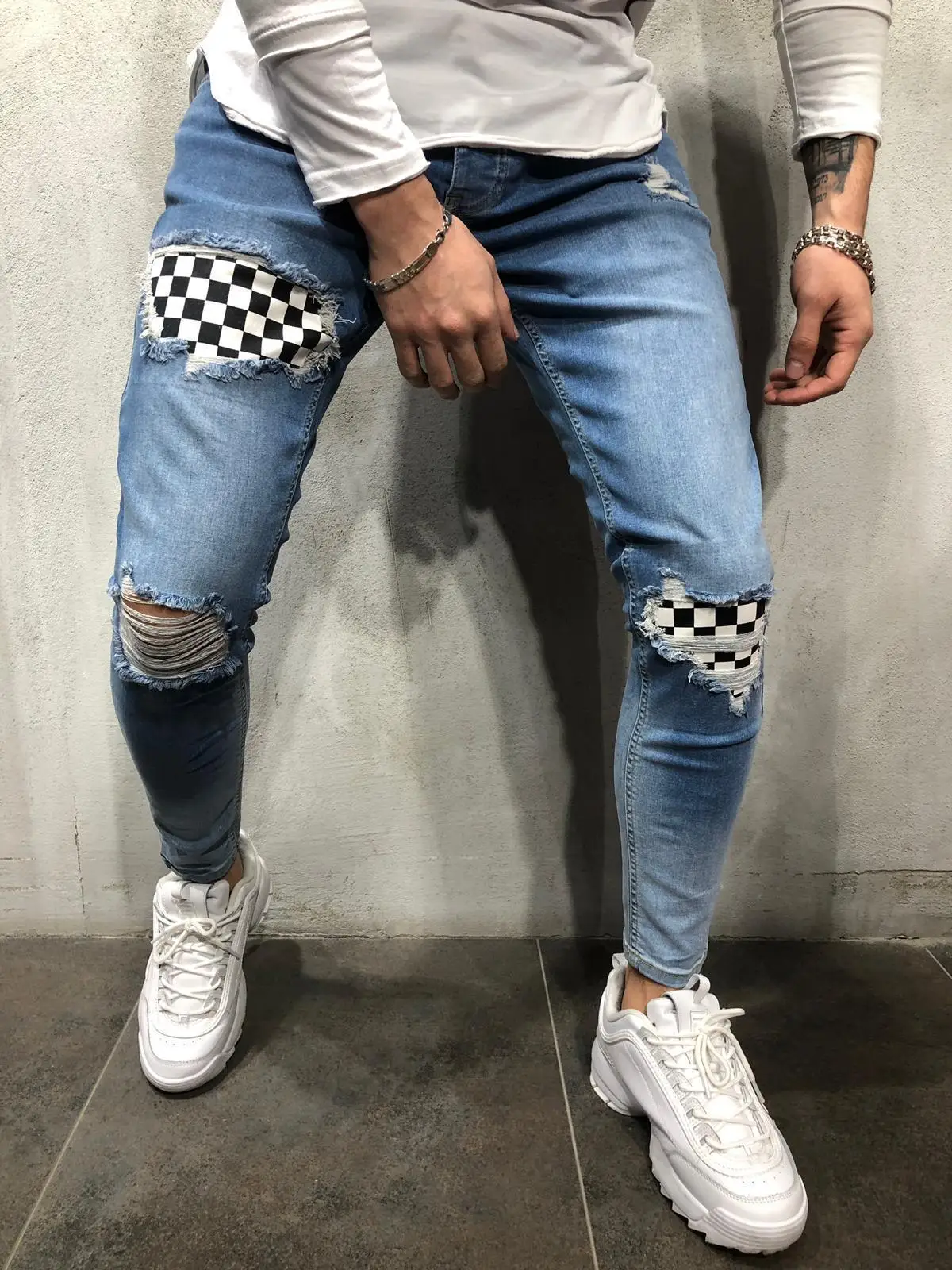 guys checkerboard patch distressed jeans