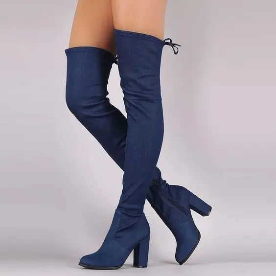 ripped jeans and thigh high boots