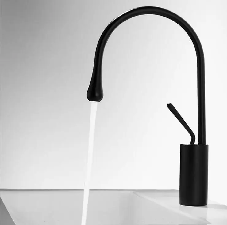 black faucet in white kitchen