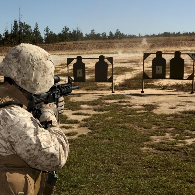 A military policeman fires a rifle at the shooting range Poster Print (16 x 12)