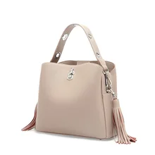 New ladies tassel bucket type leather shoulder bag European and American style wide shoulder strap slanting shoulder bag