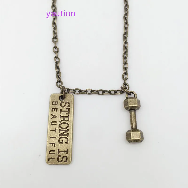 1Pcs Bronze dumbbells& STRONG IS BEAUTIFUL Chain Necklace Fitness