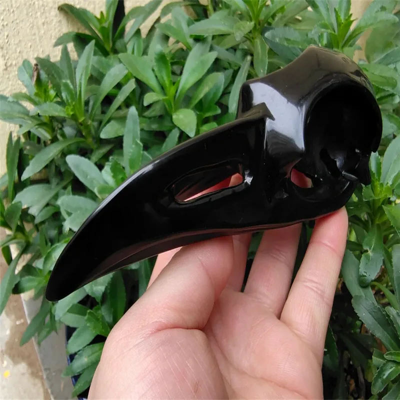 

Natural obsidian hand carved crow skull crystal healing