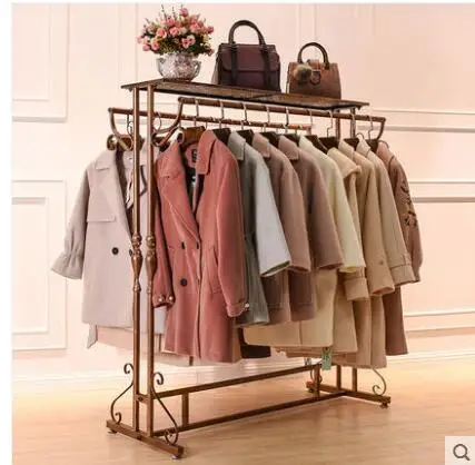 Clothes shop display rack nakajima double shelf women's clothing store parallel bars hanging clothes rack in the middle .