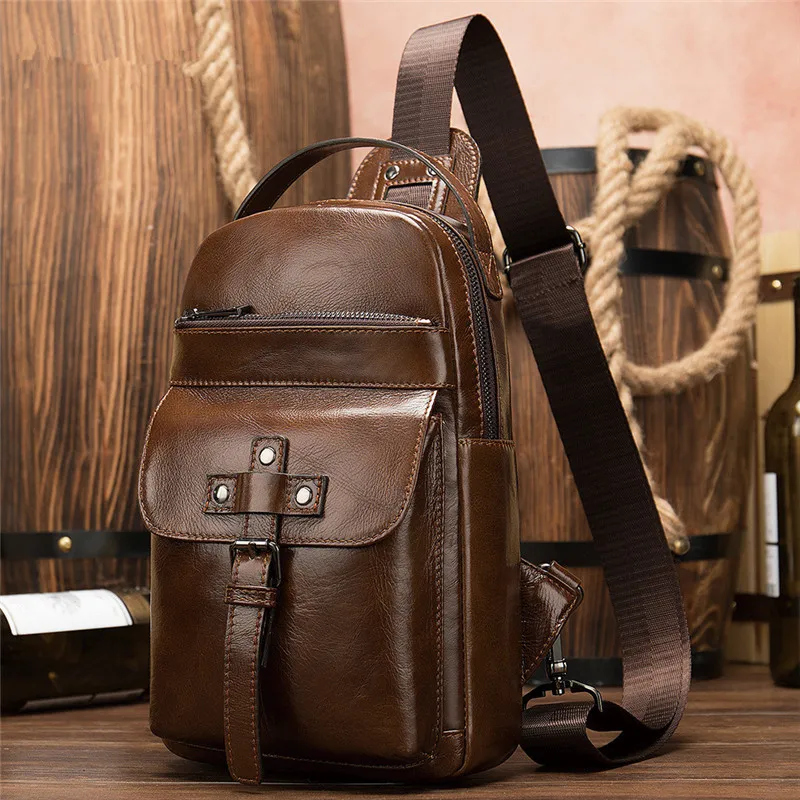 

PNDME Men's chest bag genuine leather retro fashion outdoor one shoulder solid color chest bag headphone socket