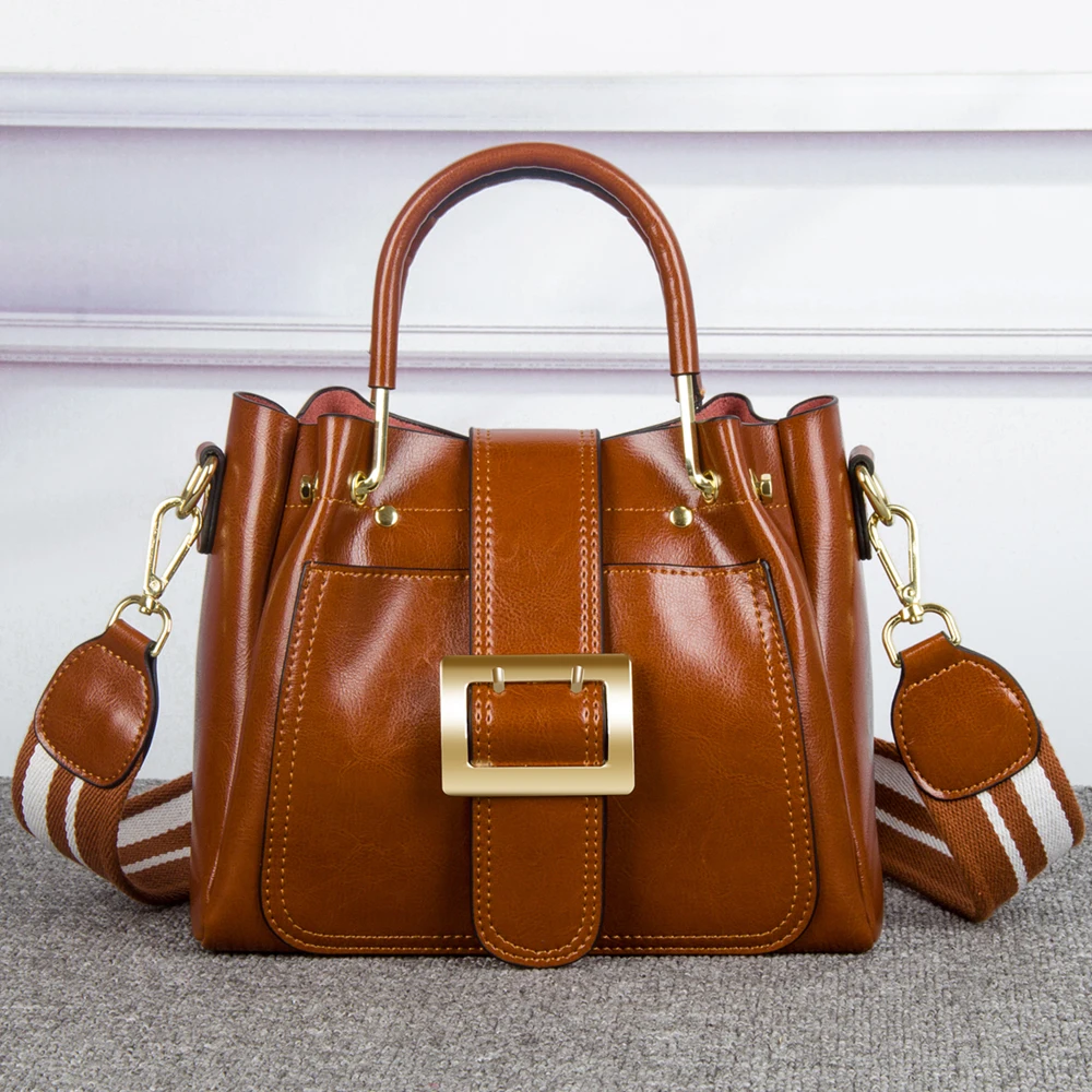 

ZKW The New Woman Korean Fashion 100% Genuine Leather Women Handbag Buckle Portable Shoulder Cowleather handbag.