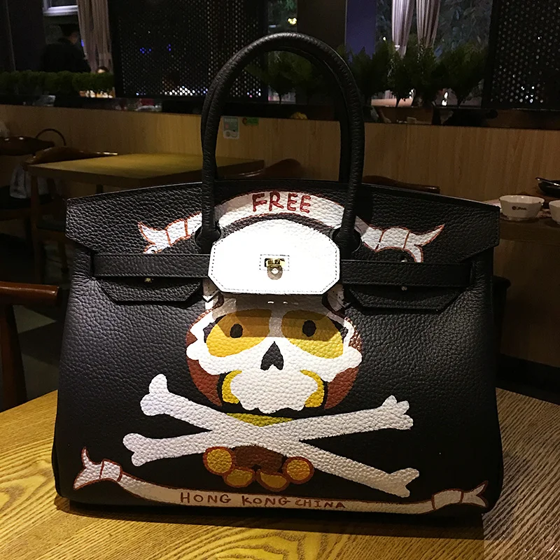 

2019 New South Korean ladies cute 100% Genuine Leather 35CM Gold Hardware Unique custom Hand-painted skull handbag cowhide