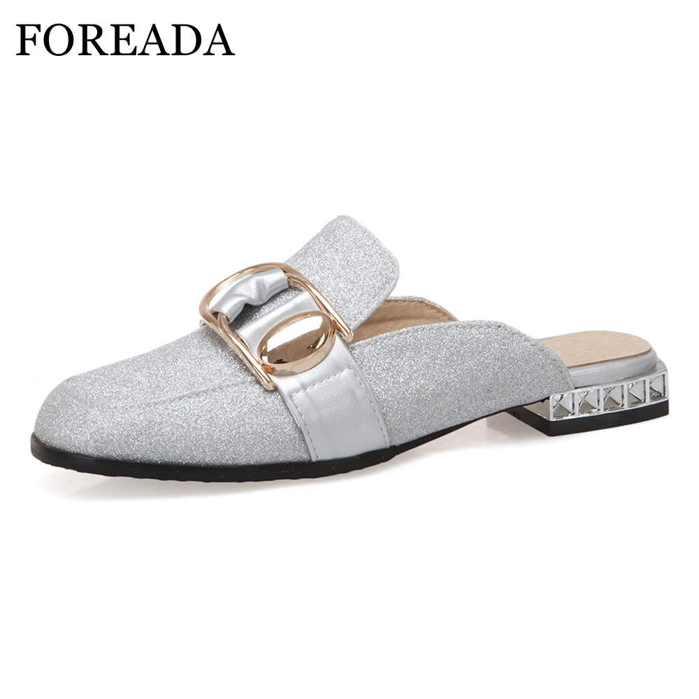mules with gold buckle