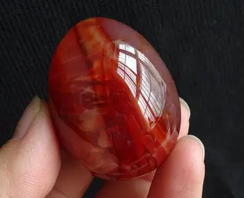 

Natural red agate egg with crystal stone hand pieces.