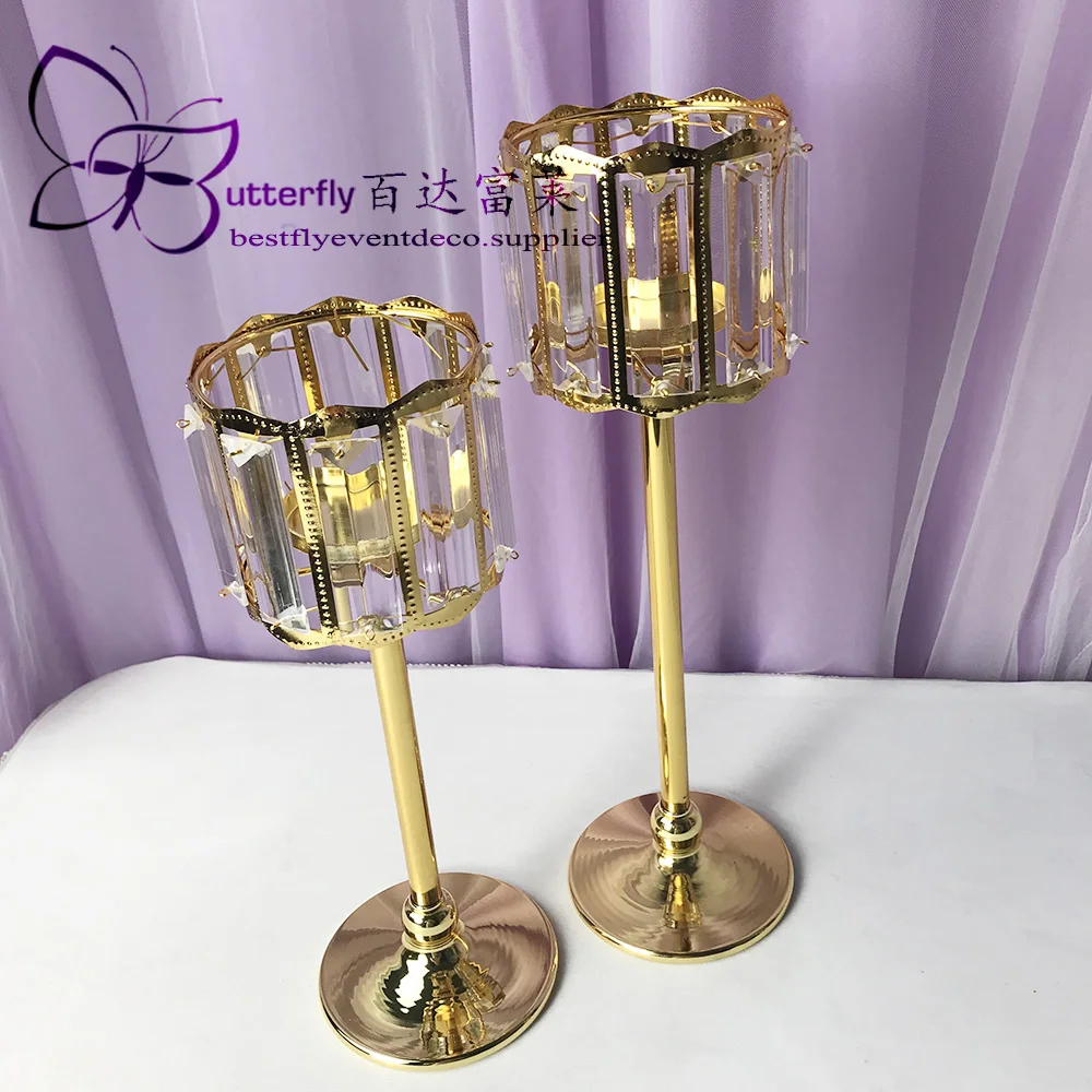 Crystal Hurricane candle holders and candlesticks around the gold trumpet vase-