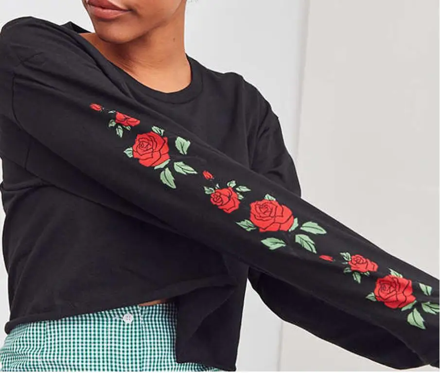 black hoodie with red roses on sleeves