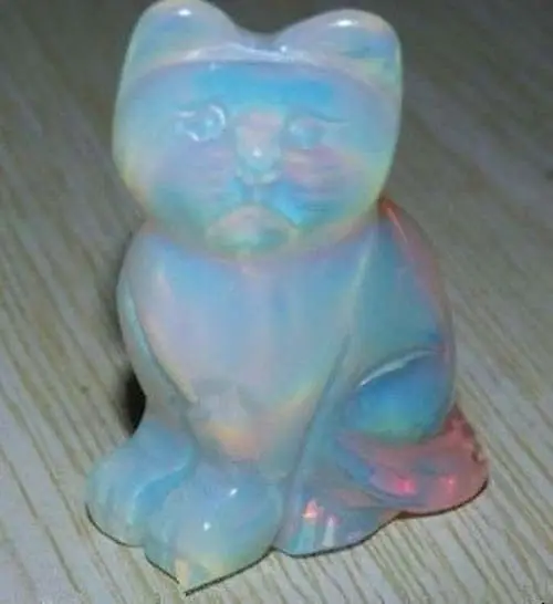 Опал кот. Эфиопский опал бусы silver. Прозрачный опал. Эфиопский опал черный. Опаловая фигурка.