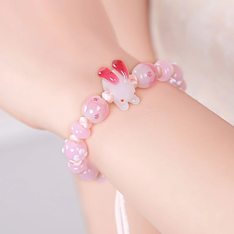 

Very popular handmade knitted bracelets with different pink glass beads and beautiful Rabbit glass beads as a gift for friends