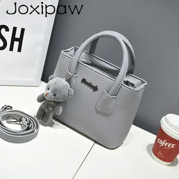 

Fast shipping, 2018 new women handbags, simple fashion flap, bear ornaments woman messenger bag, Korean version shoulder bag.