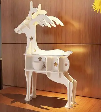 

Creative bookshelf landing shelf. A few elk. Modelling of sitting room animal decorative frame.