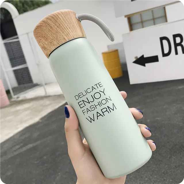 Brief Thermal Insulation Water Bottles 500ML With Rope Grain Lid Design