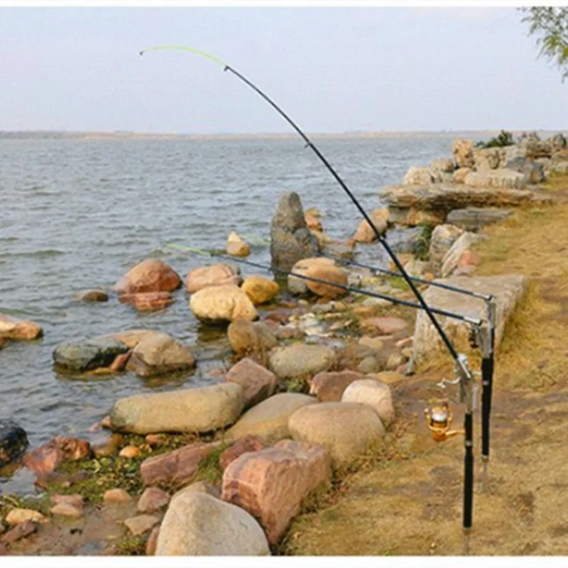 

Fishing Rod Holder with Automatic Tip-Up Hook Setter