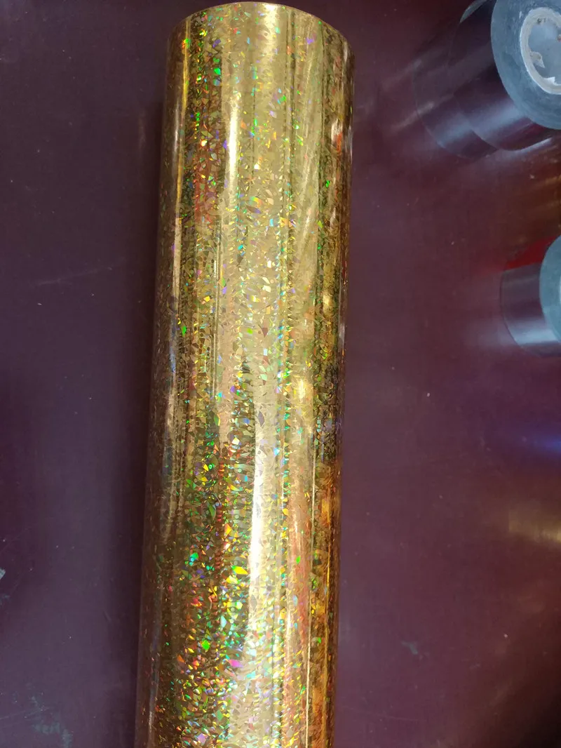 

Holographic foil Cat eyes gold color pattern hot stamping foil on paper or plastic 64cm x 120m transfer film