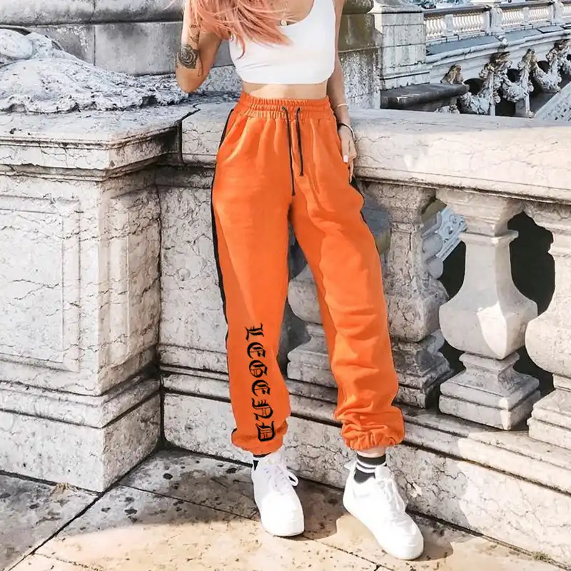 black joggers with orange stripe