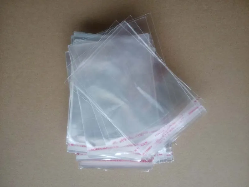 approx 50 CLEAR CELLOPHANE JEWELLERY DISPLAY BAGS/POUCHES,SEALABLE 5x5cm,10g 