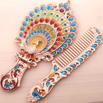 

Elegant Rose Gold Plating Peacock Design Green Red Blue Hand Painted and Jeweled Foldable Metal Alloy Hand Mirror and Comb Set