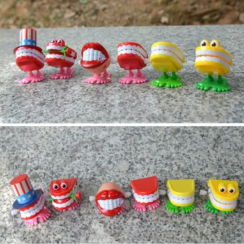 

Spring Wind up Jump Tooth Dental Gift Dental Toys wholesale spring Plastic Toys Jump Teeth Chain for Children Cute Toys For Kids