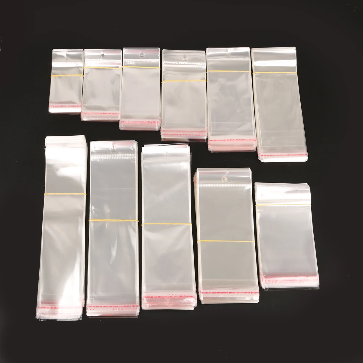 100 шт прозрачные Самоклеющиеся пластиковые целлофановые пакеты для упаковки ювелирных изделий с отверстием для подвешивания
