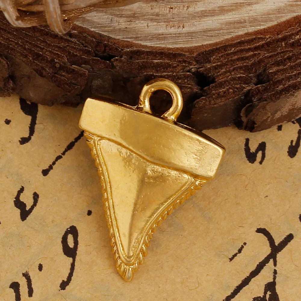 

DoreenBeads 2016 New Zinc Based Alloy Charms Shark Teeth / Tooth Pendants Gold color 25mm(1") x 18mm( 6/8"), Hole: 2.5mm 5 PCs