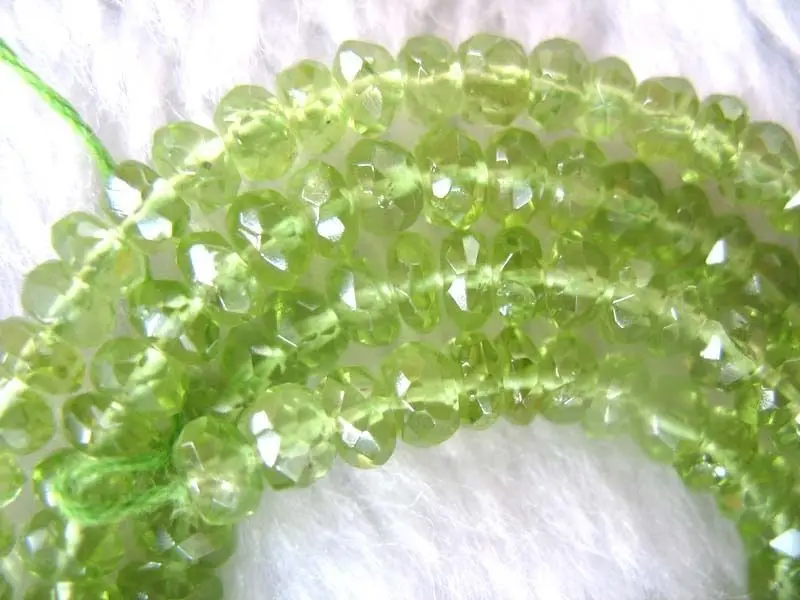 

xiuli 000424 peridot AAA roundel faceted 4*2mm beads 15" nature