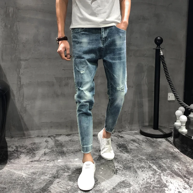 

2019 spring new hole hole foot nine points embroidery jeans male Korean version of the trend stretch Slim feet pants