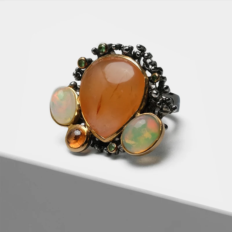 

Vintage Silver Exaggerated teardrop design inlaid semi-precious stone red agate cat's eye Rings