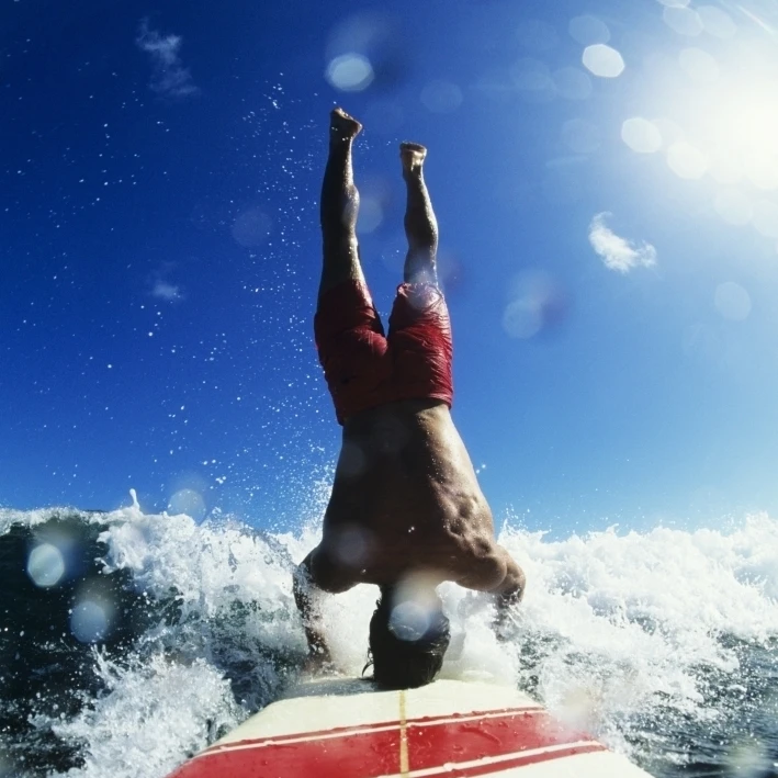 Hawaii  Maui  Hookipa  Buzzy Kerbox Riding A Wave While Doing A Headstand. Poster Print (11 x 16)