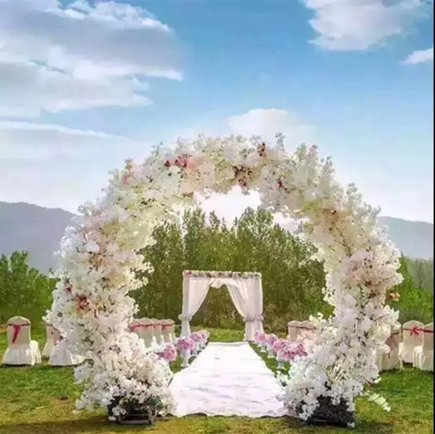 

Wedding ring iron rainbow arch background wall decorated with cherry blossom flower gate