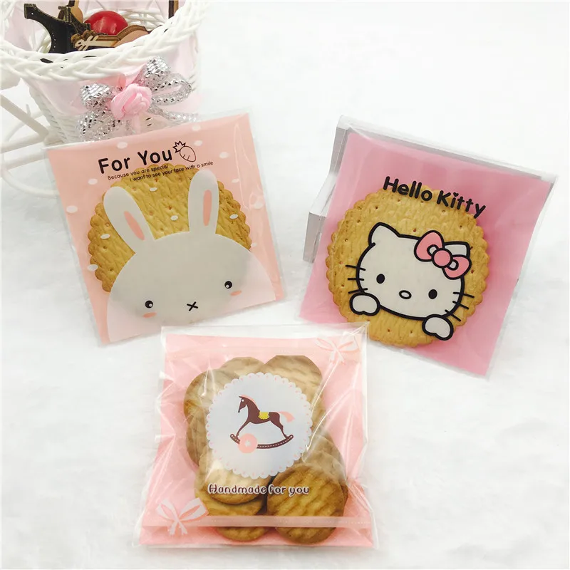 

2 sizes 100pcs Plastic Cookie Bags Transparent Cartoon Animal Cookie Bag Wedding Cake Candy Macaron Packaging Bag