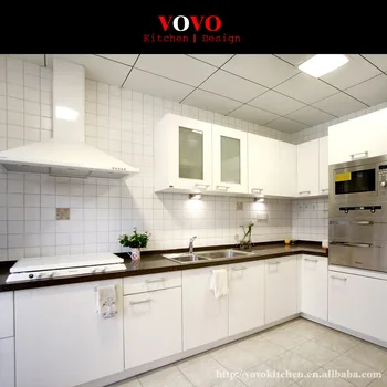 

White flat kitchen cabinet with black countertop