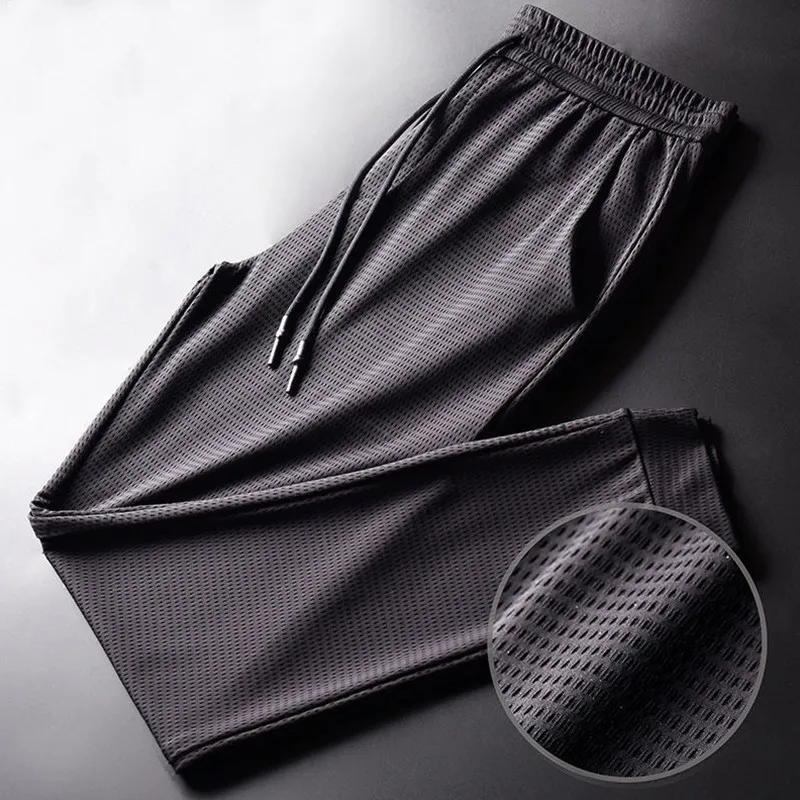 

Summer fashion Thin Ice Silk Pants Men's Loose Sports Pants Feet Stretch Nine-point Pants Quick-drying Breathable Pants