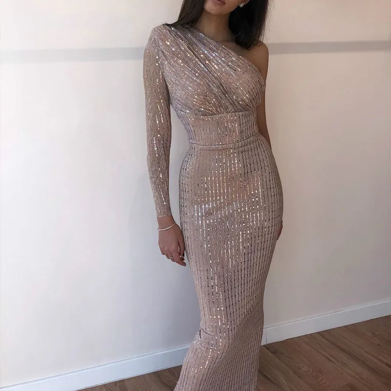 Women's dress with sequins gathered with a bright shoulder