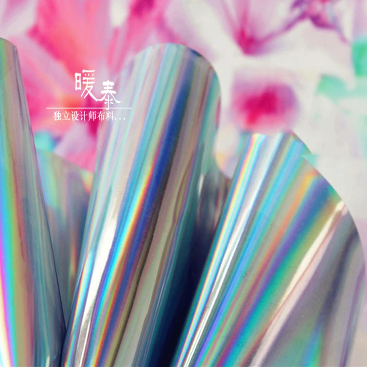 

Transparent colorful laser tpu fabric raincoat garment bag PVC fashion show leather designer fabric