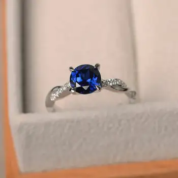 

Simple Temperament Geometric Round Ring S925 Sterling Silver Material Dark Blue Topaz Four-prong Inlaid Blue Crystal