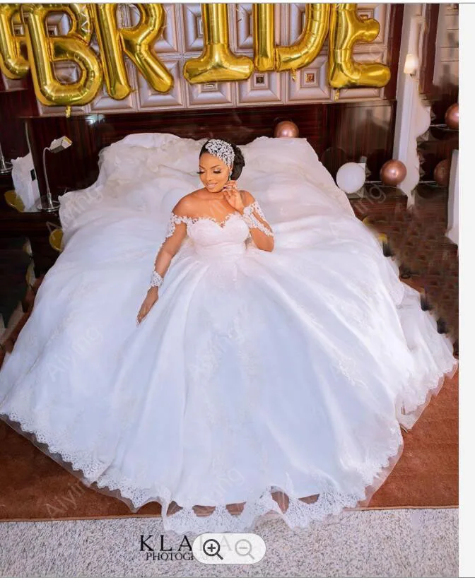

Wounderful Illsion Long Sleeves Lace Appliques African Bridal Gowns Cathedral Train Satin Puffy Big Ball Gown Wedding Dresses
