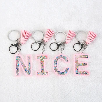 

1PC Women Keychains Glitter Hollowed-out Words Handbag English Letter Keyring with tassel Charms