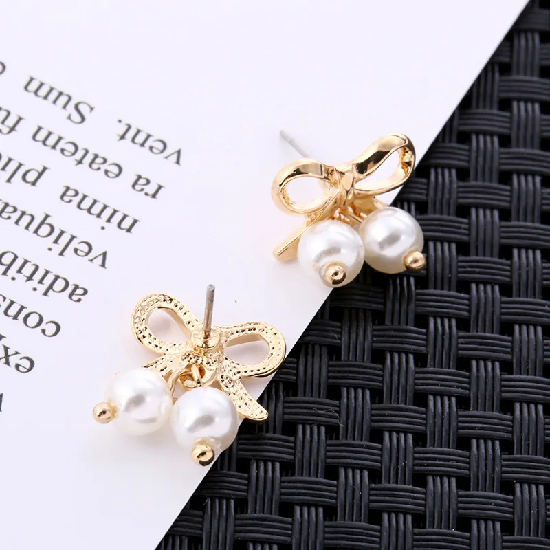 

Japan and South Korea New Bow Pearl Earrings Female Sen Senior Sense Niche Design Simple Super Fairy Temperament Tide