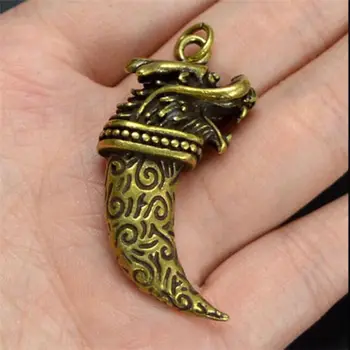 

Chinese brass dragon head Wolf tooth Exquisite Small pendant Statues #4652