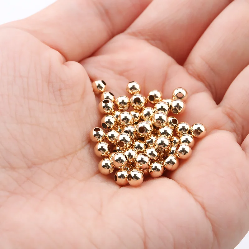 Biba Armbanden in goud beige met natuurstenen en kralen