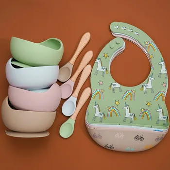 

100% Food Approval Silicone Foldable Baby Cartoon Bibs Toddler Feeding sucker Bowl Infant Training Spoon With Wooden Handle.