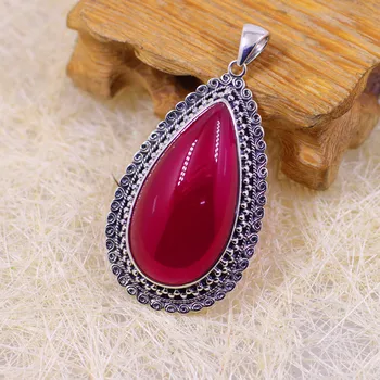 

silver carve patterns or designs on woodwork with red corundum teardrop-shaped female pendant sweater chain pendant